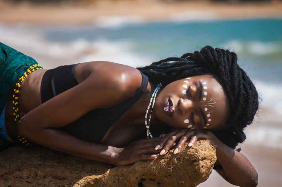 woman sleeping on a rock