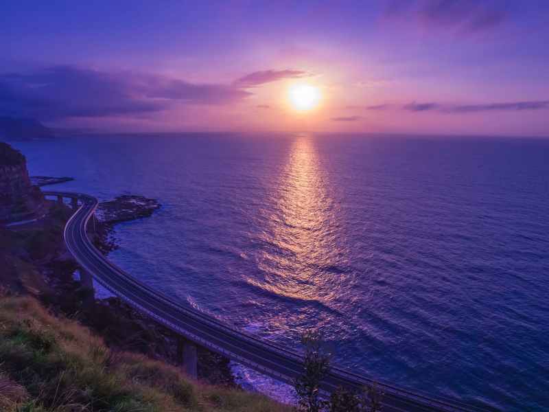body of water across sunset