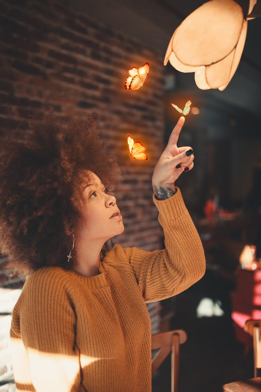 photo of woman wearing brown sweater