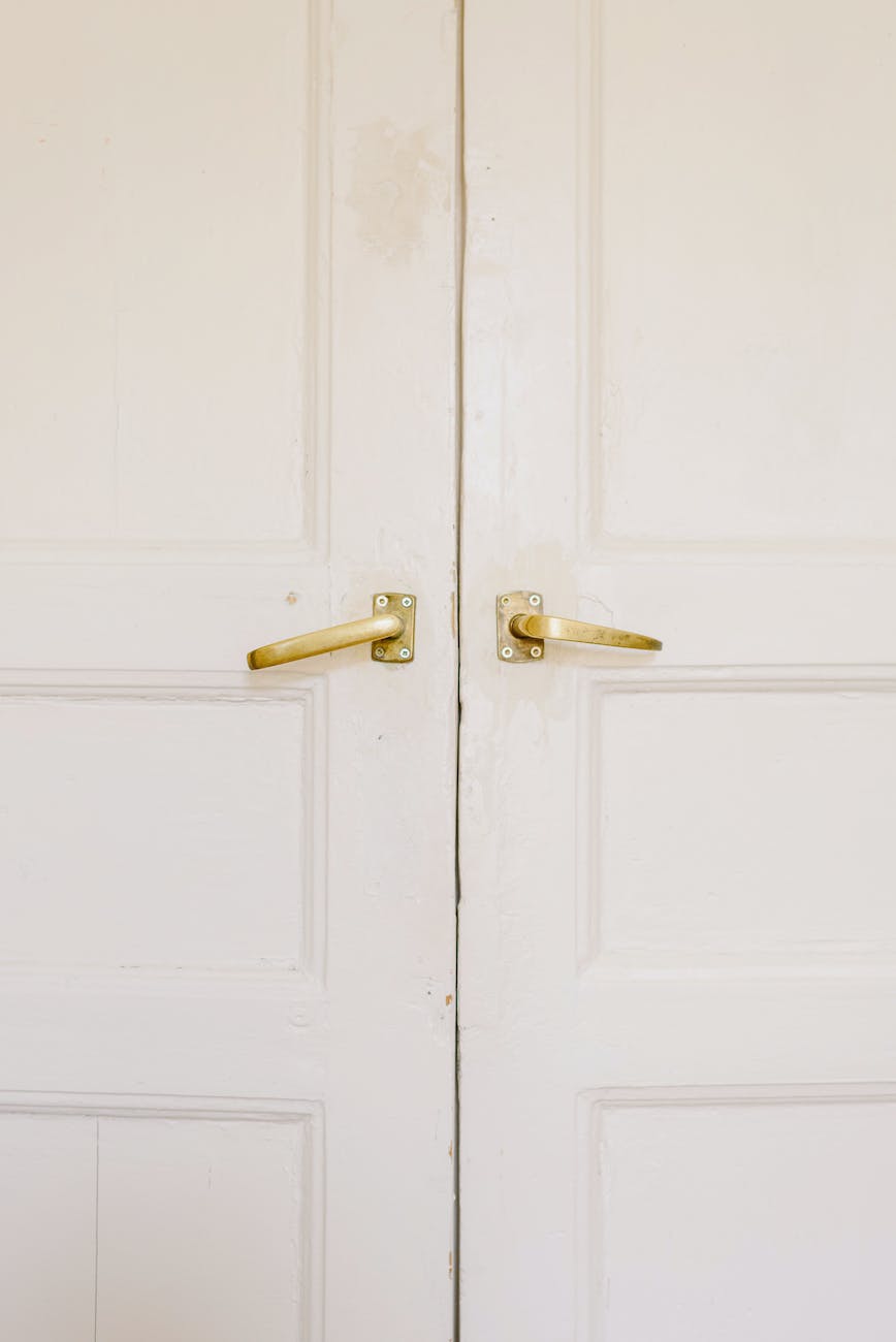 modern white house doors with golden handles